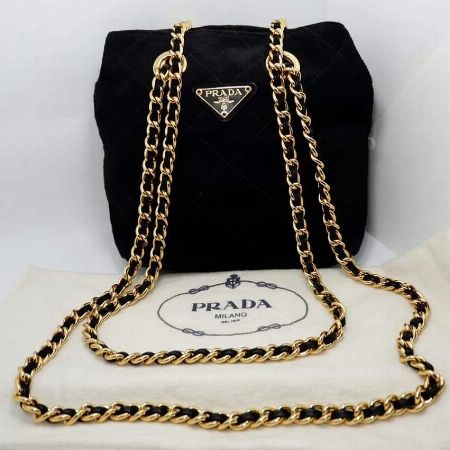 black suede bag with gold chain